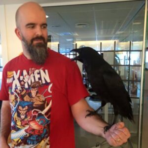 Throstur Bragason holding a raven on his arm